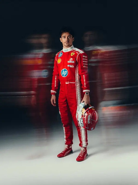 Charles leclerc in a red racing suit holding a helmet with blurred racing background