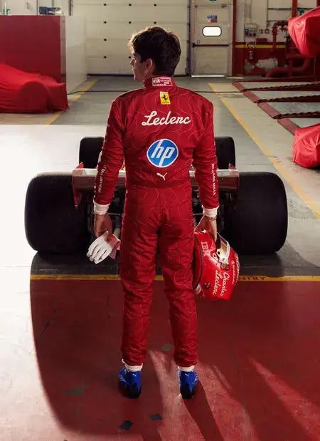 Ferrari-inspired Monza 2025 racing suit displayed on mannequin, styled after Charles Leclerc’s official gear