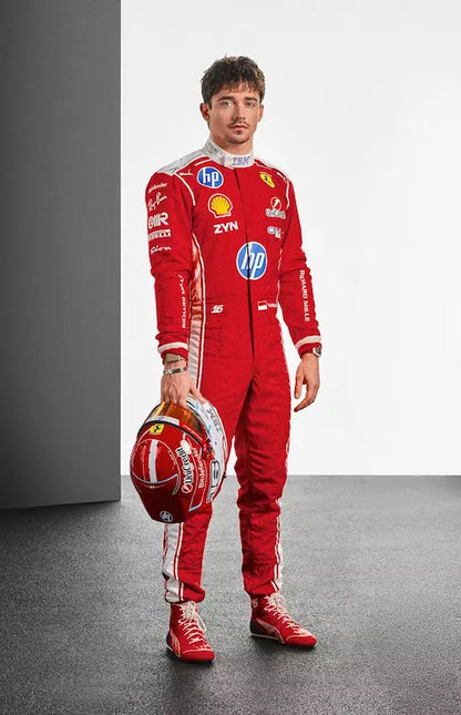 Person wearing a red racing suit with various sponsor logos, holding a helmet.