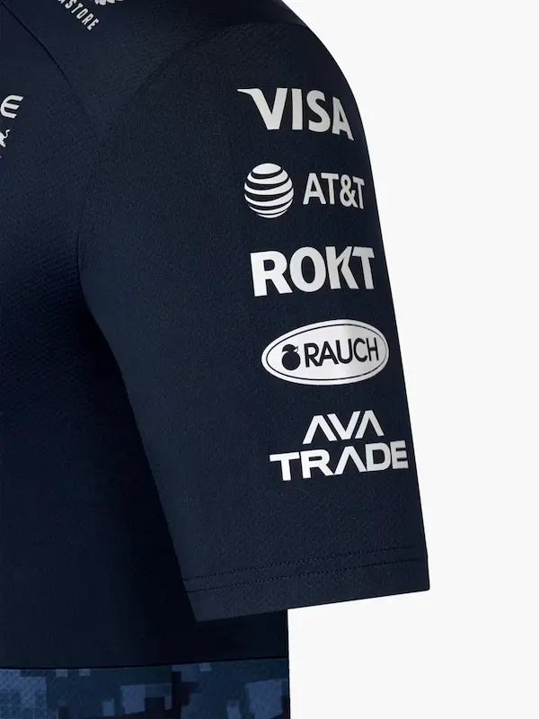 Flat lay of the AT Racing Red Bull replica polo shirt, showcasing the front design, logos, and premium material texture