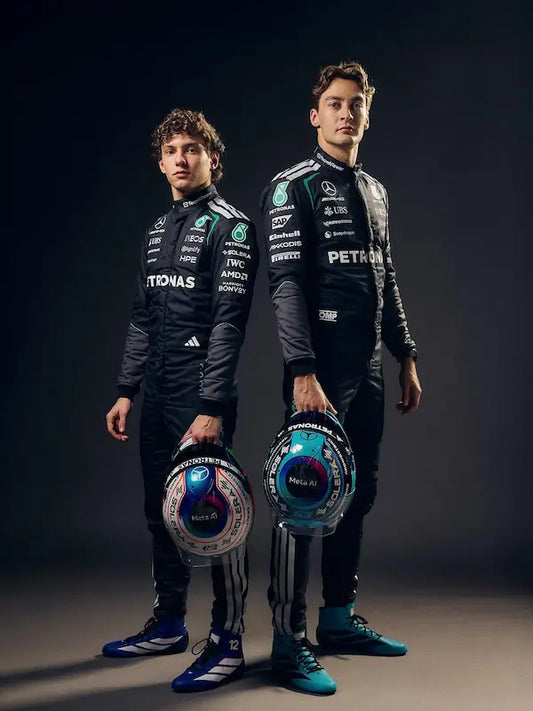 Close-up detail of INEOS, Petronas, and team partner logos on the suit.