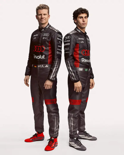 Two individuals wearing Audi racing suits on a white background