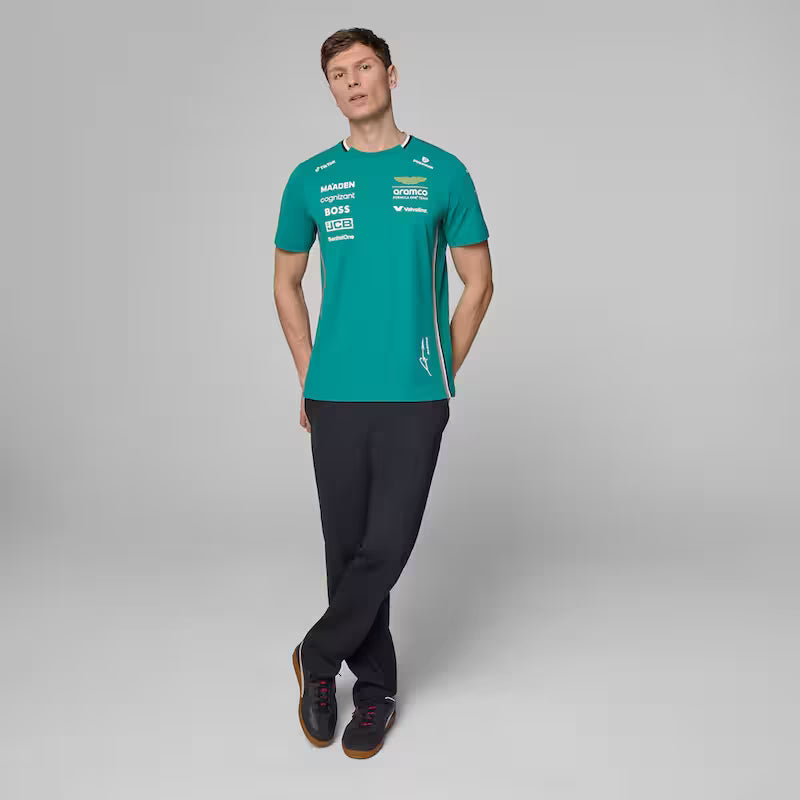 Person wearing a teal sports outfit with branding on a gray background