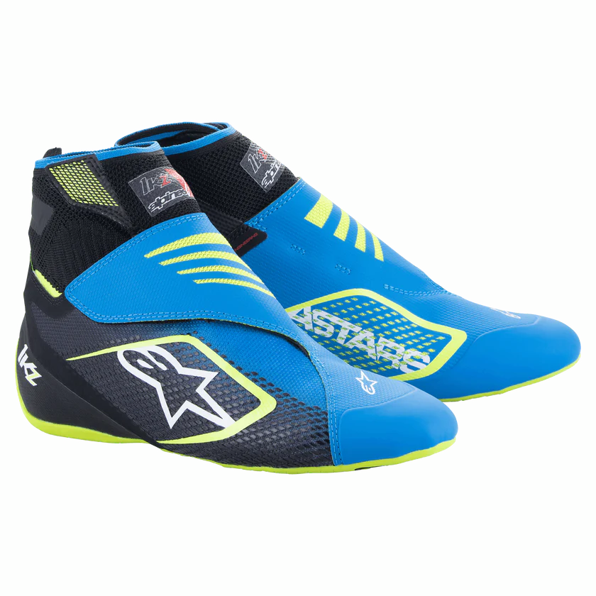 Blue and black racing shoes with yellow accents on a white background