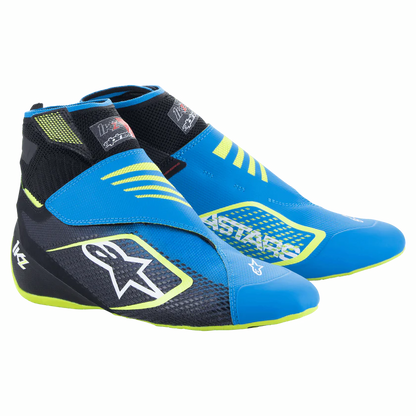 Blue and black racing shoes with yellow accents on a white background
