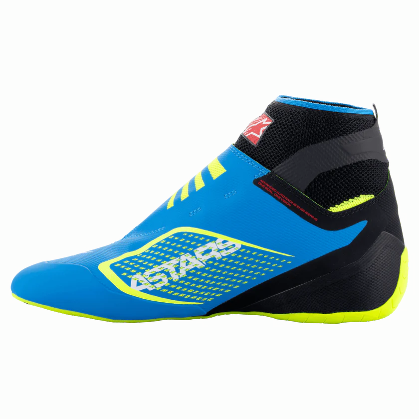Blue and black racing shoe with yellow accents on a white background
