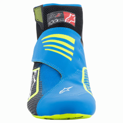Blue and black racing boot with yellow accents on a white background