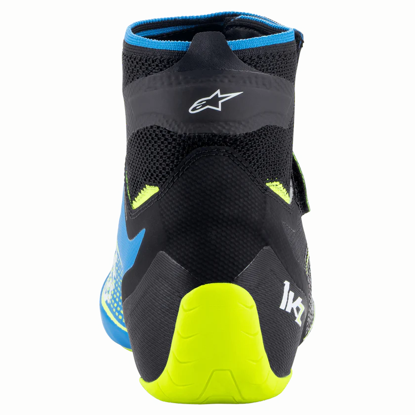 Black and blue shoe with yellow sole on a white background