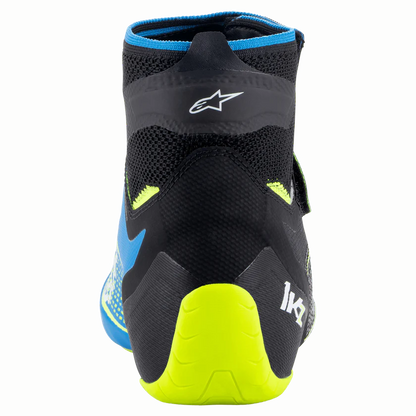 Black and blue shoe with yellow sole on a white background